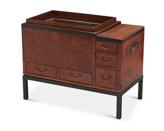 2354
A Japanese wood hibachi
20th century
The hibachi with metal liner, five drawers, and opposed inset handles, raised on an enameled metal stand
Overall: 22.5" H x 28.5" W x 15.5" D
Estimate: $300 - $500