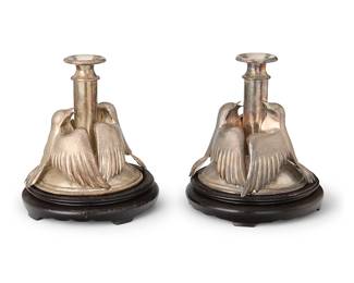 2371
A pair of silver-plated figural candlesticks
20th century
Each turned standard with two applied bird figures, set on a wood stand
2 pieces
Each overall: 7.75" H x 6.75" Dia.
Estimate: $100 - $200