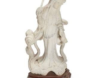 2183
A Chinese carved marble figure of Guanyin
20th century
The female figure depicted in flowing robes and an elaborate headpiece, holding a lotus flower in one hand and a branch of peaches in the other, raised on a carved wood stand
Stone: 34.75" H x 17.75" W x 11" D; Stand: 5.75" H x 18" W x 14.75" D
Estimate: $700 - $900