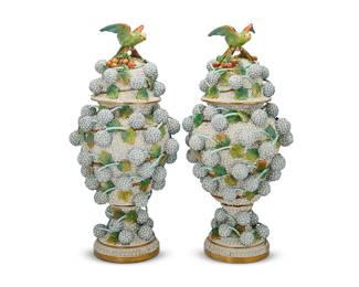 2407
A pair of large Dresden porcelain Schneeballen vases and covers
19th century
Each with spurious underglaze blue crossed swords mark over an oval dot
The ogee bodies applied with branches of mayflowers, the small flowerheads with blue edges and yellow dot centers, the domed covers with a parrot perched on a branch of cherries
2 pieces
Each: 31.5" H x 14" Dia.
Estimate: $3,000 - $5,000