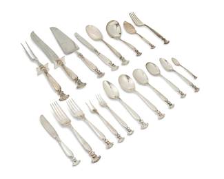2022
A Wallace sterling silver 'Romance of the Sea' flatware service
Mid/late 20th century
Each marked for Wallace and sterling; most marked with pattern name
Designed 1950, comprising 14 dinner knives (9.125"), 14 butter spreaders (6.375"), 14 dinner forks (7.5"), 14 salad forks (6.5"), 8 cocktail forks (5.625"), 18 teaspoons (6.125"), 8 oval soup spoons (6.875"), 13 cream soup spoons (6"), 1 larger cream soup spoon (6.625"), 3 table/serving spoons (8.5"), 2 serving forks (8"), 1 demitasse spoon (4"), 1 sugar spoon (6"), 1 gravy ladle (6.625"), 1 pickle/olive fork (5.5"), 1 jelly server (6.5"), 1 cake/pie server (11"), and a 2-piece carving set (Larger: 13.75")
117 pieces
Weighable sterling: 144.8 oz. troy approximately
Estimate: $3,000 - $5,000