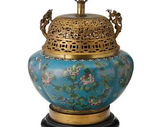 2056
A Chinese cloisonné censer mounted as a lamp
20th century
The polychrome enameled metal censer with a gilt-brass openwork lid, converted to a single-light lamp with a carved wood base, the body depicting floral, avian, and ruyi motifs, electrified
Overall: 18.5" H x 12" Dia.; Censer sight: 12" H x 12" Dia.
Estimate: $300 - $500