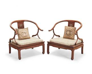 2305
A pair of Chinese horseshoe armchairs
20th century
The carved wood chairs, each with an openwork splat and flat seat with fabric upholstered seat cushion and throw cushion
2 pieces
Each: 32" H x 29.5" W x 24.5" D
Estimate: $400 - $600