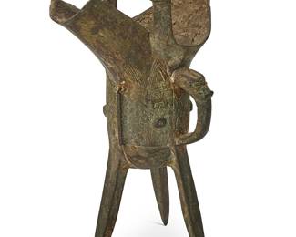 2133
A Chinese archaistic bronze jue-form libation cup
Likely Song Dynasty (960-1279 CE) or later
In an Eastern Zhou style, with chased designs
7.75" H x 5.75" W x 3.125" D
Estimate: $800 - $1,200