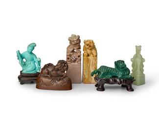 2332
Three Chinese carved hardstone seals
20th century
Each carved with a dragon or guardian lions, together with a composition deer seal, a malachite lion-form snuff bottle, and a carved blue stone figure
6 pieces
Largest seal: 3.5" H; Snuff bottle 2.75" L
Estimate: $400 - $600