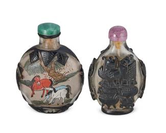 2157
Two Chinese overlay glass snuff bottles
Late 19th/early 20th century
Each overlaid with black glass, one reverse-painted depicting a mountain landscape and horses
2 pieces
Taller: 2.875" H
Estimate: $300 - $500