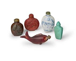 2364
Five Chinese snuff bottles
20th century
Comprising a hardstone bottle carved with turtles, a quartz Koi-form bottle, a turquoise stone bottle, a blue and white porcelain bottle, and a cinnabar-style bottle
5 pieces
Each: 2.5"-3" H; Koi: 4" L
Estimate: $600 - $900