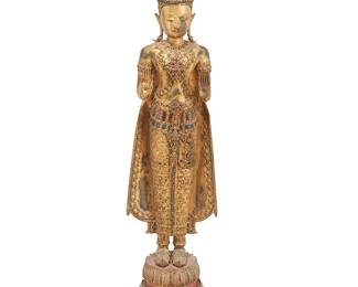 2293
A Thai gilt-bronze standing Buddha figure
19th century or later
The figure adorned with inset glass cabochons to robe and base, with hands in abhaya mudra and ushnisha flame headpiece, standing on a tiered base
52.25" H x 13.75" W x 15.25" D
Estimate: $300 - $500