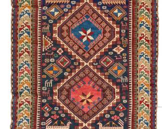 2451
A Caucasian geometric area rug
Early 20th century
Wool on wool foundation
7' L x 4' 3" W
Estimate: $400 - $600