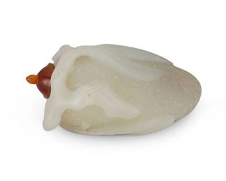 2165
A Chinese carved nephrite fruit-form snuff bottle
Late 19th/early 20th century
With leaf-forms in relief and chased design
2.75" L
Estimate: $400 - $600
