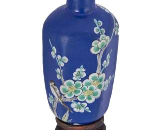 2141
A Chinese Yixing ceramic snuff bottle
18th/19th century
Decorated in enamel with green and white flowering branches with a bird perched on a branch against a blue ground, mounted on a hardwood stand
3" H
Estimate: $600 - $800