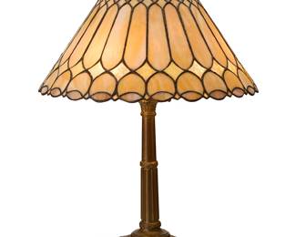 2098
A Duffner & Kimberly leaded glass and metal table lamp
Circa 1910-1920
Heat cap stamped: 532 C
The three-light lamp with patinated metal columnar base bearing laurel garlands, surmounted by a flaring leaded glass shade, electrified
Base: 23.5" H x 6.5" W x 6.5" D; Shade: 9" H x 19" Dia.
Estimate: $3,000 - $5,000