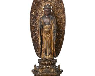 2205
A Japanese gilt and lacquered wood Amida Nyorai figure
Possibly late Edo Period (1603-1867) or later
The figure depicted with hands in raigo-in mudra, inlaid glass urna to forehead, and aureole carved with cloud motifs, standing atop a double lotus base and architectural pedestal carved with cloud and foliate motifs
26.25" H x 10" W x 7" D
Estimate: $1,000 - $2,000