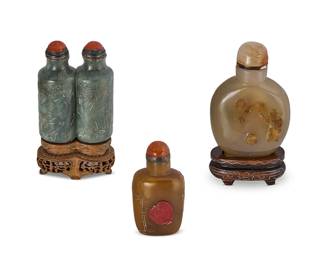 2160
Three Chinese carved stone snuff bottles
19th/early 20th century
Comprising two agate and one nephrite double bottle, two mounted on carved wood stands
3 pieces
Tallest overall: 3.625" H
Estimate: $400 - $600