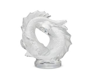 2109
A Lalique molded glass 'Deux Poissons' centerpiece
Lat 20th/early 21st century
With etched script mark: Lalique ® France [post-1978]; with applied Lalique factory sticker
Designed 1953 by Marc Lalique (1900-1977)
Model 11622, the molded glass centerpiece depicting two intertwined carp, raised on a circular base
11.375" H x 10.375" W x 5.5" D
Estimate: $700 - $900