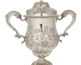 2006
An Edward VII sterling silver trophy cup
1903
Vessel and lid each marked for sterling, London, date, and maker: G & S Co., Ltd [Goldsmiths & Silversmiths Co Ltd]
The lidded trophy with repoussé floral and foliate motifs throughout, opposed scroll handles, and reeded trim, the interior with a gold wash
16" H x 13.75" W x 7" D
94.8 oz. troy approximately
Estimate: $2,000 - $4,000