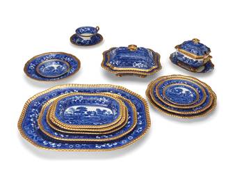 2419
A Copeland Spode earthenware 'Spode's Tower' dinner service
1914-1917
Each with blue underglaze mark: Copeland / Spode's Tower / England; most impressed with Copeland Spode backstamp and date stamp
The blue and white transferware service, each with gilt gadrooned rims, comprising 7 dinner plates (10.75"), 4 luncheon plates (9.5"), 12 salad plates (7.75"), 11 bread plates (5.375"), 8 wide rim soup bowls (9.5"), 11 fruit bowls (5.5"), 8 flat cups (2.25") with 11 saucers (6.125"), 2 covered vegetable servers (Each: 5.125" H x 8.25" W x 10" D), 1 covered sauce boat with attached underplate (5.5" H x 8.125" W x 6.375" D), 3 graduated serving platters (Largest: 17.5" W x 13.75" D), and 2 vegetable bowls (Larger: 10" W x 7.75" D)
80 pieces
Estimate: $800 - $1,200