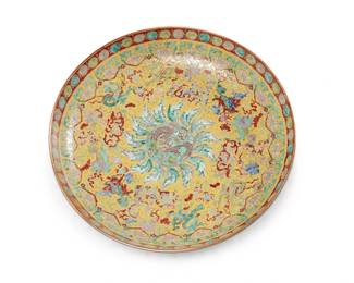 2359
A Chinese yellow ground enameled porcelain charger
Circa 1900 or later
With red underglaze Qianlong Period (1736-1795) reign mark
Together with two East Asian porcelain chargers
3 pieces
Yellow ground: 15.75" Dia.; Other chargers: 18" and 16" Dia.
Estimate: $800 - $1,200