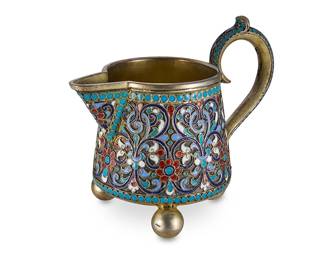 2077
A Russian cloisonné and silver creamer
1892
With Russian hallmarks for Moscow, 84 zolotnik, and assay master Lez Fridrikhovitch Oleks
The creamer with scrolled handle raised on three ball feet, featuring enameled floral motifs, filigree, and a vermeil wash
3.25" H x 3.875" W x 2.375" D
Estimate: $1,000 - $1,500