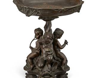 2257
A Napoleon III patinated bronze figural center bowl
After a model by Auguste-Maximilien Delafontaine, 19th century
Stamped to underside: 4317
The bowl interior with figures of musicians in relief, the exterior featuring animal figures, raised on a tripartite base with three child figures depicted atop dolphins, their tails meeting together and twisted to form the standard, set on three turtle-form feet
13.75" H x 11.875" Dia.
Estimate: $400 - $600