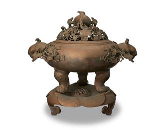 2308
A large Chinese bronze figural censer
20th century
Cast with mice, leaves, and floral motifs, the openwork top surmounted by a fish figure, raised on ruyi-form tripod feet
3 pieces
Overall: 27" H x 29.75" W x 20.5" D
Estimate: $400 - $600