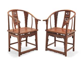 2314
A pair of Chinese carved wood horseshoe chairs
20th century
Each with rounded crest rail/armrests above a back splat with openwork figural motifs and openwork aprons with front panel accents to supports and stretcher
2 pieces
Each: 39.25" H x 26" W x 24.5" D
Estimate: $500 - $700