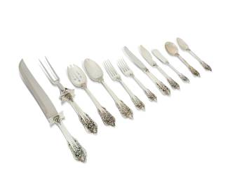 2026
A Wallace sterling silver 'Grand Baroque' flatware service
20th century
Each marked for Wallace and for sterling
Comprising 20 dinner knives (9"), 7 butter spreaders (6.5"), 1 master butter knife (7.5"), 20 dinner forks (7.5"), 23 salad forks (6.5"), 20 teaspoons (6.25"), 8 soup spoons (6.25"), 4 serving spoons (8.75"), 1 slotted serving spoon (8.75"), and a carving set (Longest: 13.75")
106 pieces
Weighable sterling: 136.7 oz. troy approximately
Estimate: $4,000 - $6,000