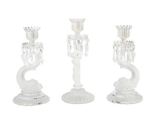 2258
Three Baccarat glass figural candlesticks
Late 20th century
Each with Baccarat stenciled factory marks
Comprising a pair with dolphin-form standards and a single with putto-form standard, each faceted with drop prisms
3 pieces
Each dolphin: 13.5" H x 6.75" Dia.; Putto: 15.25" H x 6.125" Dia.
Estimate: $1,000 - $1,500