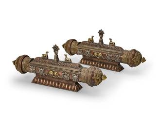 2120
A pair of Tibetan Buddhist incense burners
18th century or later
Each with low-relief decorations depicting the Ashtamangala, or Eight Auspicious Symbols, featuring a hinged openwork lid mounted with animal figures and a medallion centered by inlaid turquoise
2 pieces
Each: 7.25" H x 17.5" W x 3.5" D
Estimate: $1,200 - $1,800