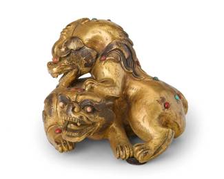2307
A Chinese gilt-bronze double guardian lion group
17th century or later
The figures depicted in combat or play, each with applied turquoise and coral accents
4.375" H x 5.75" W x 5.875" D
Estimate: $2,000 - $3,000