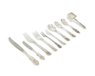 2275
A Wallace sterling silver 'Sir Christopher' flatware service
Most marked for Wallace and sterling
Comprising 12 dinner knives (9.125"), 12 butter spreaders (6.25"), 12 dinner forks (7.375"), 24 salad/cake forks (6.375"), 12 cocktail forks (5.625"), 12 teaspoons (6"), 12 cream soup spoons (6"), and 1 corn butterer (5.375"), together with 6 cocktail forks from the "Rose Point" pattern (5.625"), and 1 Watson "Poppy" teaspoon (5.5")
104 pieces
Weighable sterling: 95.7 oz. troy approximately
Estimate: $2,500 - $3,500