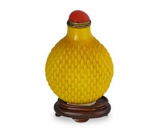 2161
A Chinese Peking glass snuff bottle
20th century
Mounted to a carved wood stand
Overall: 3" H
Estimate: $300 - $500