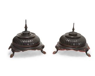 2291
A pair of Burmese Hsun Ok offering jars
20th century
Each tripod lidded bowl with lobed cover and turned finial above an openwork apron, black lacquered to exterior and red to interior
2 pieces
Each: 23.75" H x 25" Dia.
Estimate: $300 - $500