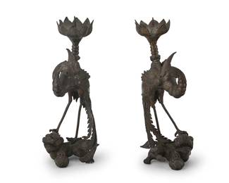 2309
A pair of Chinese bronze phoenix candlesticks
20th century
Each with a lotus bobèche above a phoenix depicted standing atop a guardian lion with a ball under one paw
2 pieces
15.25" H x 6.25" W x 6.25" D
Estimate: $400 - $600