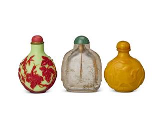 2366
Three Chinese snuff bottles
19th/20th century
Comprising a red overlay green glass bottle carved with a grasshopper and grapes, with a bridge on the reverse, a glass bottle incised with mountains and trees, and a butterscotch glass bottle carved with a phoenix
3 pieces
Tallest: 3" H; Shortest: 2.75" H
Estimate: $800 - $1,200