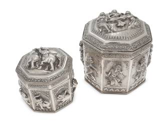 2277
Two Burmese sterling silver boxes
20th century
Each marked to underside
Each hexagonal vessel with elaborate chased and repoussé scrolled motifs surrounding haute-relief cartouches, one with elephants and one with dancing figures
2 pieces
Larger: 8" H x 8.25" Dia.; Smaller: 6" H x 6.25" Dia.
55.7 oz. troy approximately
Estimate: $800 - $1,200