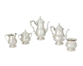 2015
A Durham sterling silver tea and coffee service
Mid-20th century; New York
With Durham pictorial hallmarks and further marked: Sterling / 225 / Hand Chased
Comprising a coffee pot (11" H x 9" W x 5 D), a teapot (9.25" H x 9.375" W x 5.25" D), a cream jug (5.5" H x 5.25" W x 3.375" D), a covered sugar (6.25" H x 6.75" W x 4.25" D), and a waste bowl (4" H x 4.5" Dia.)
5 pieces
Total weight: 72.4 oz. troy approximately
Estimate: $1,800 - $2,500