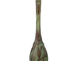2090
A Gallé cameo glass solifleur vase
Circa 1900
Signed in relief: Gallé
The slender footed tall vase with frosted ground, layered with a foliate motif
15" H x 3.25" Dia.
Estimate: $800 - $1,200