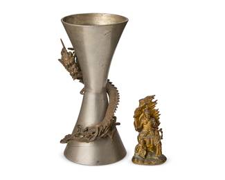 2202
Two Japanese cast metal items
19th/20th century
Comprising a gilt-metal figure of Fudo Myo-o depicted seated and holding a sword, flanked by two smaller figures, and an hourglass-shaped vase with haute relief dragon figure
2 pieces
Figure: 4.5" H x 2.375" W x 2" D; Vase: 9.375" H x 5" Dia.
Estimate: $600 - $800