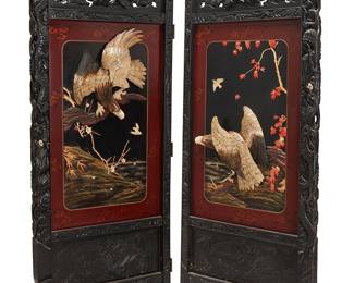 2052
A Chinese hardstone-mounted wood two-panel screen
20th century
The black lacquered screen with two panels, each panel mounted with carved bone and mother-of-pearl eagles in high relief within an aquatic shoreline scene with blooms, crested by a carved openwork dragon figure with inset bone eyes
72" H x 62" W x 3" D
Estimate: $300 - $500