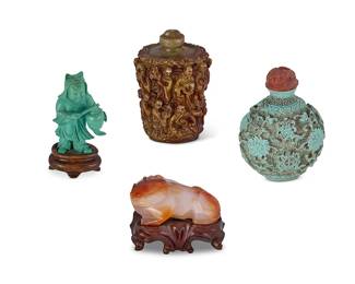 2162
A group of Chinese carved items
20th century
Cat with a wax seal to underside bearing Chinese characters
Comprising a carved turquoise figure, a carved agate model of a cat, and two composite snuff bottles, two mounted on a wood stand
4 pieces
Tallest: 3" H
Estimate: $300 - $500