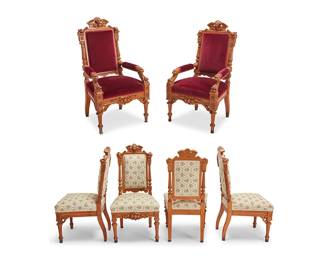 2429
A set of twelve Horner-style Renaissance Revival oak dining chairs
Mid/late 19th century
Comprising ten side chairs with floral pattern fabric upholstery and two armchairs with red velvet upholstery, each carved oak chair with a broken pediment-style crest centering a lion mask flanked by carved flowers over columnar supports with rosettes, with an upholstered back and seat over a conformingly carved seat rail, raised on reeded toupie front feet
12 pieces
Each side chair: 40.75" H x 20.5" W x 21.5" D; Each armchair: 45.75" H x 24.5" W x 27" D
Estimate: $800 - $1,200