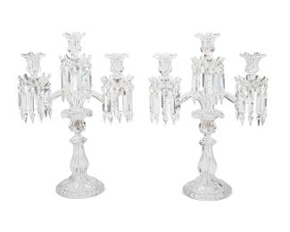 2272
A pair of Baccarat 'Medallion' candelabra
Late 20th/early 21st century
Each marked for Baccarat
The three-light candelabra, each with two arms and central pedestal issuing three floriform bobèches and twenty-eight prisms, raised on a foliate standard with a beaded base
2 pieces
Each: 17.75" H x 13" W x 5.375" D
Estimate: $1,000 - $1,500
