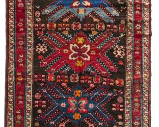 2449
A Caucasian geometric area rug
Early 20th century
Wool on wool foundation
10' 4" L x 4' 3" W
Estimate: $800 - $1,200