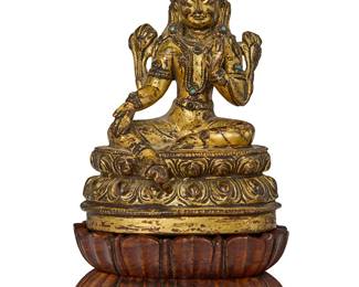 2123
A Tibetan gilt-bronze seated Bodhisattva
17th century or later
Likely Avalokitesvara, the figure with inset turquoise cabochons, depicted seated on a double lotus base, set on another carved wood double lobed base
Metal: 4.125" H x 3" W x 2.125" D; Base: 1.5" H x 3.375" W x 2.375" D
Estimate: $1,000 - $1,500