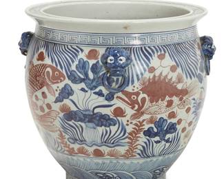 2360
A Chinese porcelain jardinière
20th century
With four ringed lion's head masks and painted in blue and iron red with an underwater scene with koi
19.5" H x 21.5" Dia.
Estimate: $200 - $400