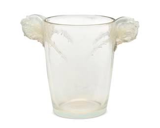 2107
A René Lalique glass 'Chamarande' vase
Marcilhac 974, model introduced 1926
Wheel-cut: R LALIQUE / FRANCE; further etched: N 974
The molded iridescent glass vase with opposed rose cluster handles, issuing thorny branch motifs in relief
7.875" H x 9.5" W x 5.875" D
Estimate: $700 - $900