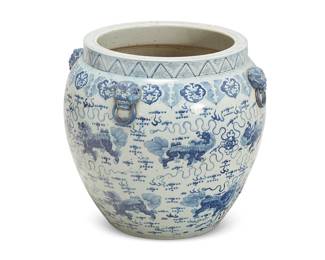 2369
A large blue and white porcelain jardinière
20th century
With four lion masks under the rim, painted with Chinese-style figural and cloud motifs
23" H x 25.5" Dia.
Estimate: $300 - $500