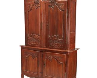 2265
A Louis XV provincial buffet a deux corps
18th/19th century
The upper unit with locking hinged cabinet doors surmounted by an architectural scroll cornice, opening to reveal two shelves and the interior later lined with fabric upholstery, the lower unit with locking hinged doors revealing a single shelf, all raised on front scroll and rear square feet
Lower: 39" H x 58.5" W x 21" D; Upper: 57.25" H x 55" W x 18" D; Overall: 96.25" H
Estimate: $800 - $1,200