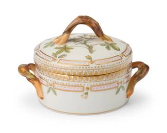 2435
A Royal Copenhagen porcelain 'Flora Danica' covered sugar bowl
1969-1973
Bowl and lid each marked to underside: Royal Copenhagen [with dot under 'G'] / [crown logo] / Denmark / 20 / 3502; further marked with three waves in blue underglaze
Designed 1790, the lidded sugar bowl with opposed foliate-form handles, hand-painted with gilt embellishments, depicting a botanical to lid
3" H x 4.375" W x 3.25" D
Estimate: $400 - $600